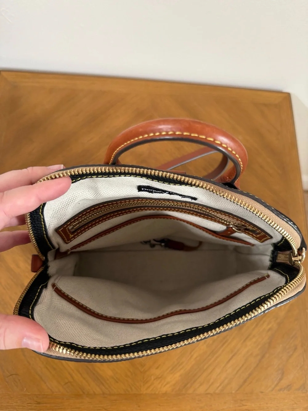 Dooney & Bourke Black Backpack with Brown Trim and Gold Hardware